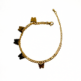 Gold bracelet with heart-shaped charms on a white background