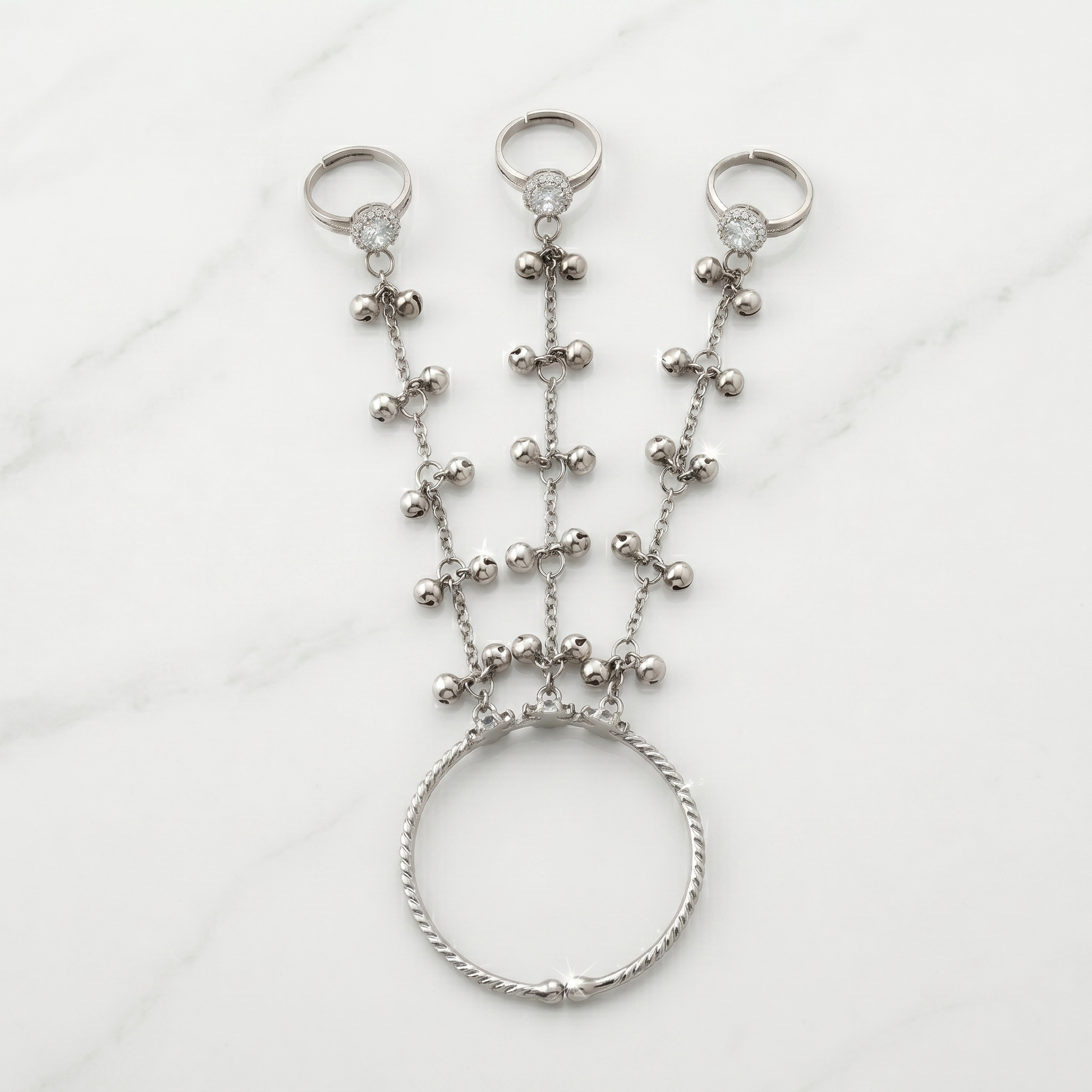 Silver beaded hand chain on a white background