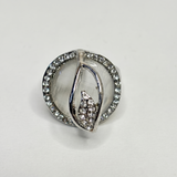 Silver ring with gemstones on a light gray background