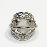 Silver ring with intricate design on a white background