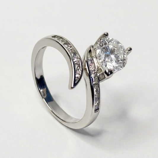 Silver ring with a large diamond on a white background