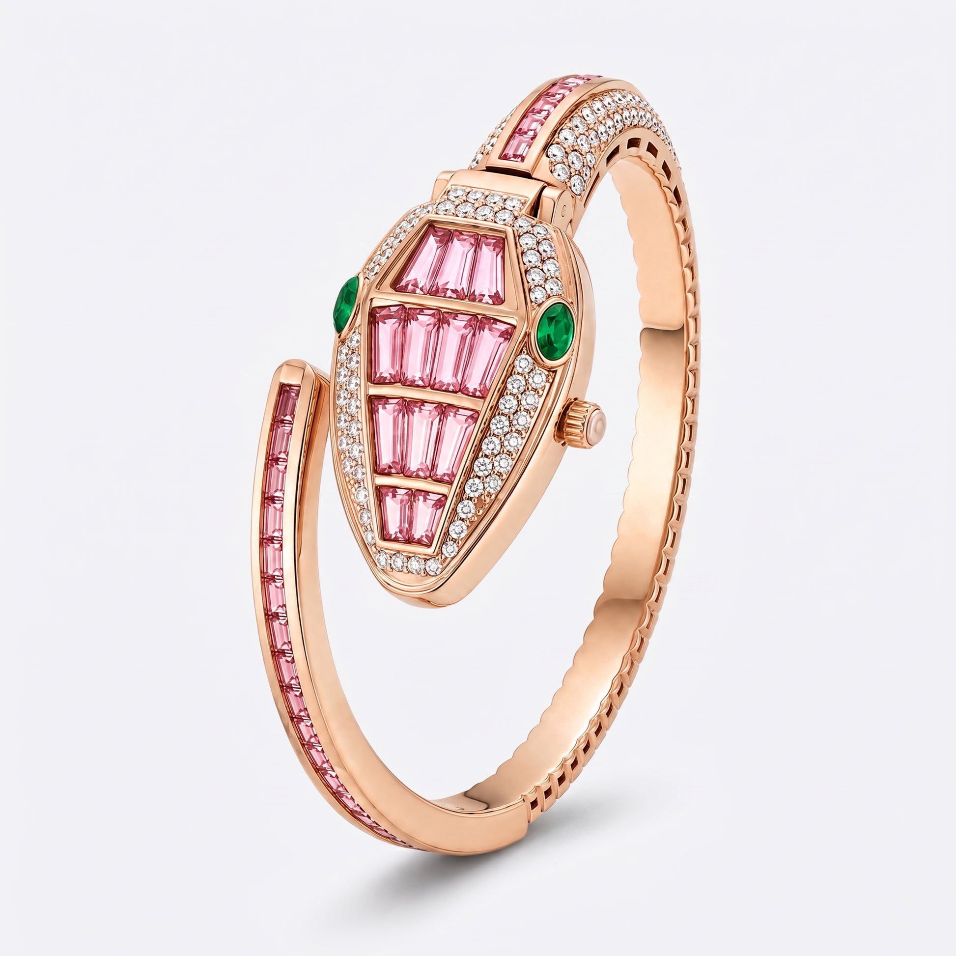 A rose gold snake-shaped bangle ring featuring pink and green stones, set with small clear crystals, on a light gray background.