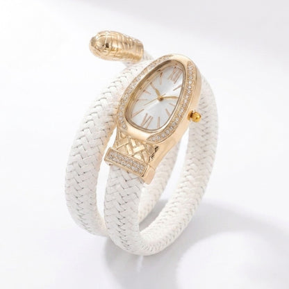 A luxury wrap bracelet watch featuring a white braided leather strap, a gold-toned oval case accented with pavé crystals, and a white dial with gold Roman numerals.